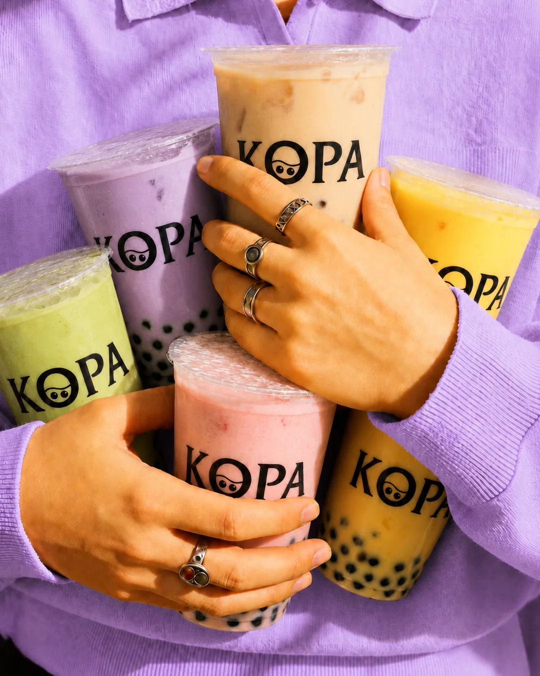 Colorful KopaTea drinks shared with friends